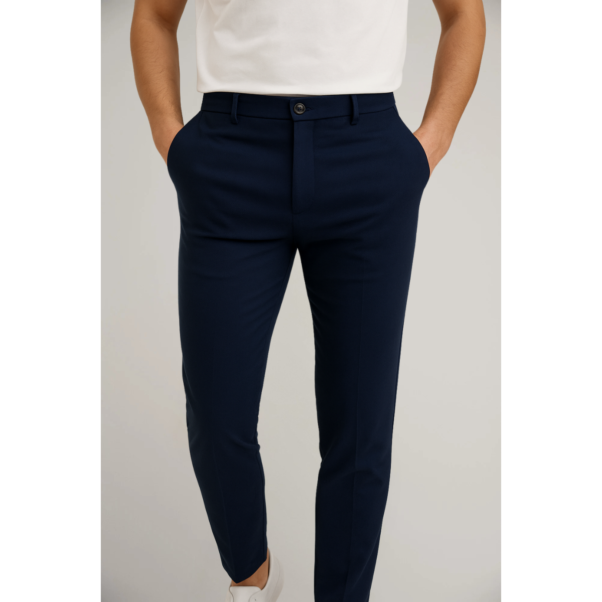Slim fit tailored trousers, navy blue with belt loops and button front.