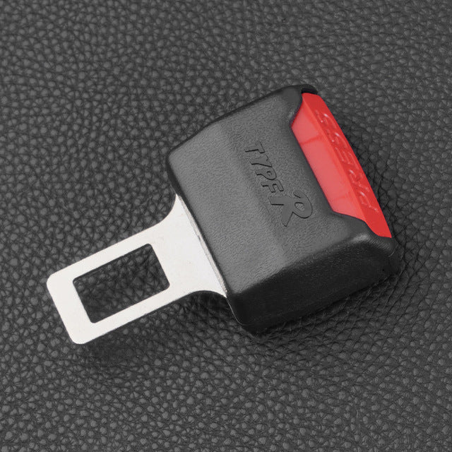 Car seat belt extender, close-up of black clip with red side release