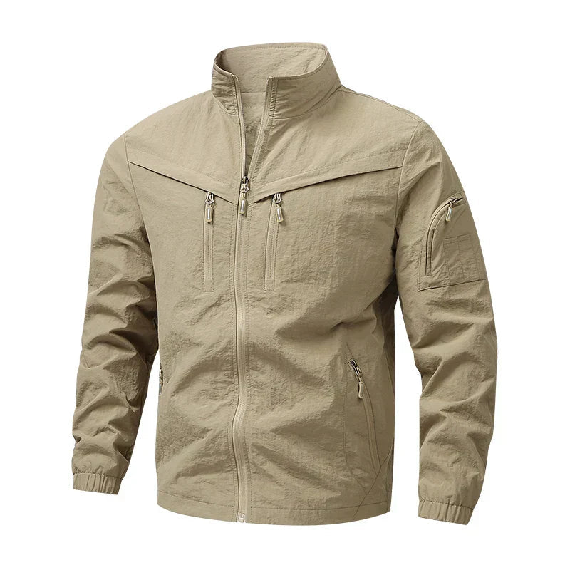 Men's stand-collar multi-pocket jacket, khaki beige with zip front and zip chest pockets.