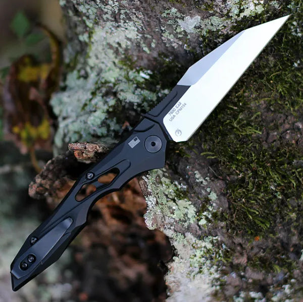 Black auto-fold utility knife with wharncliffe blade, open and ready