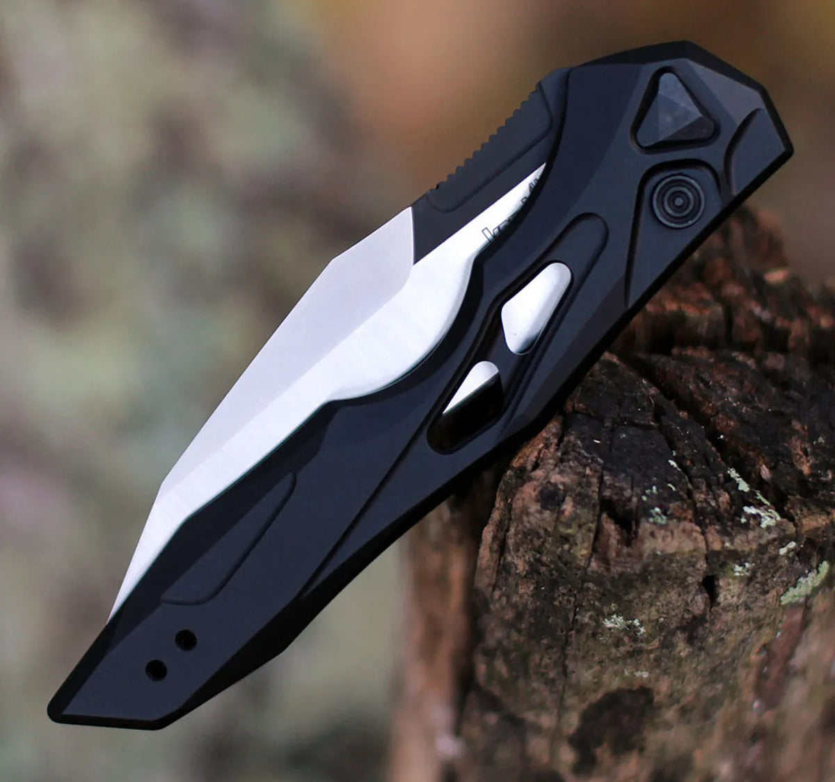 Black auto-fold utility knife with wharncliffe blade, blade and lock detail