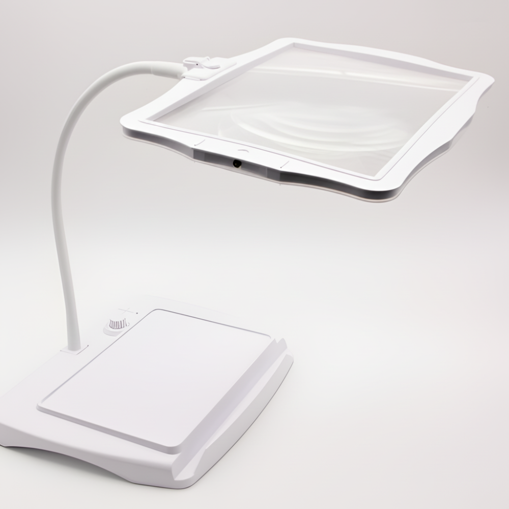 White LED magnifier reading lamp with rectangular lens and flat base, adjustable neck.