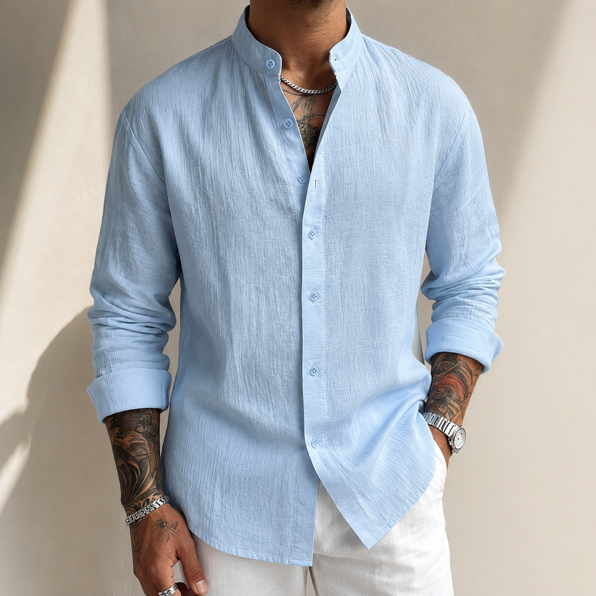Light blue textured henley button shirt with stand collar and long sleeves