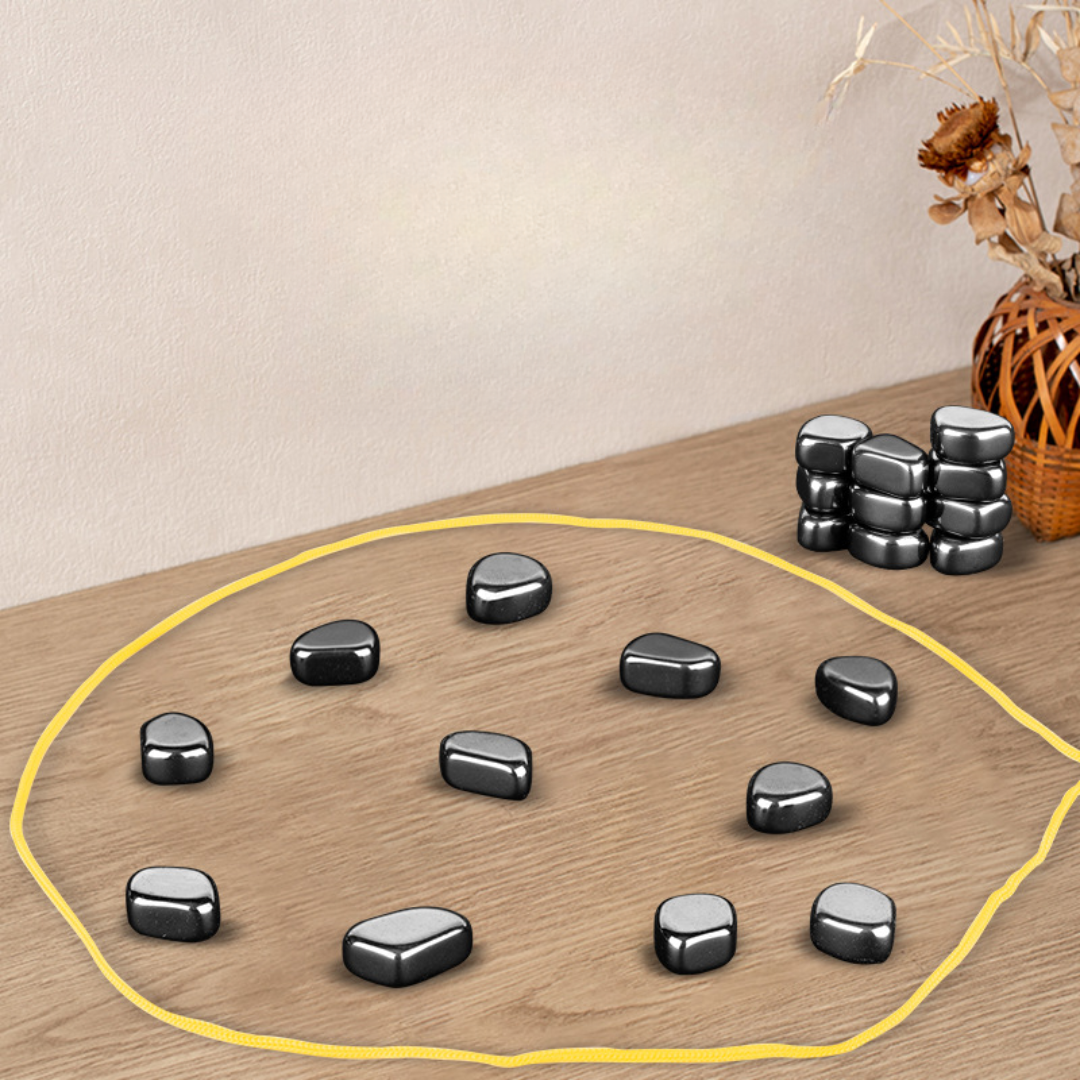 Magnetic strategy board game with yellow ring, black magnets, and stacked pieces