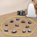 Magnetic strategy board game board with yellow ring and black magnetic stones