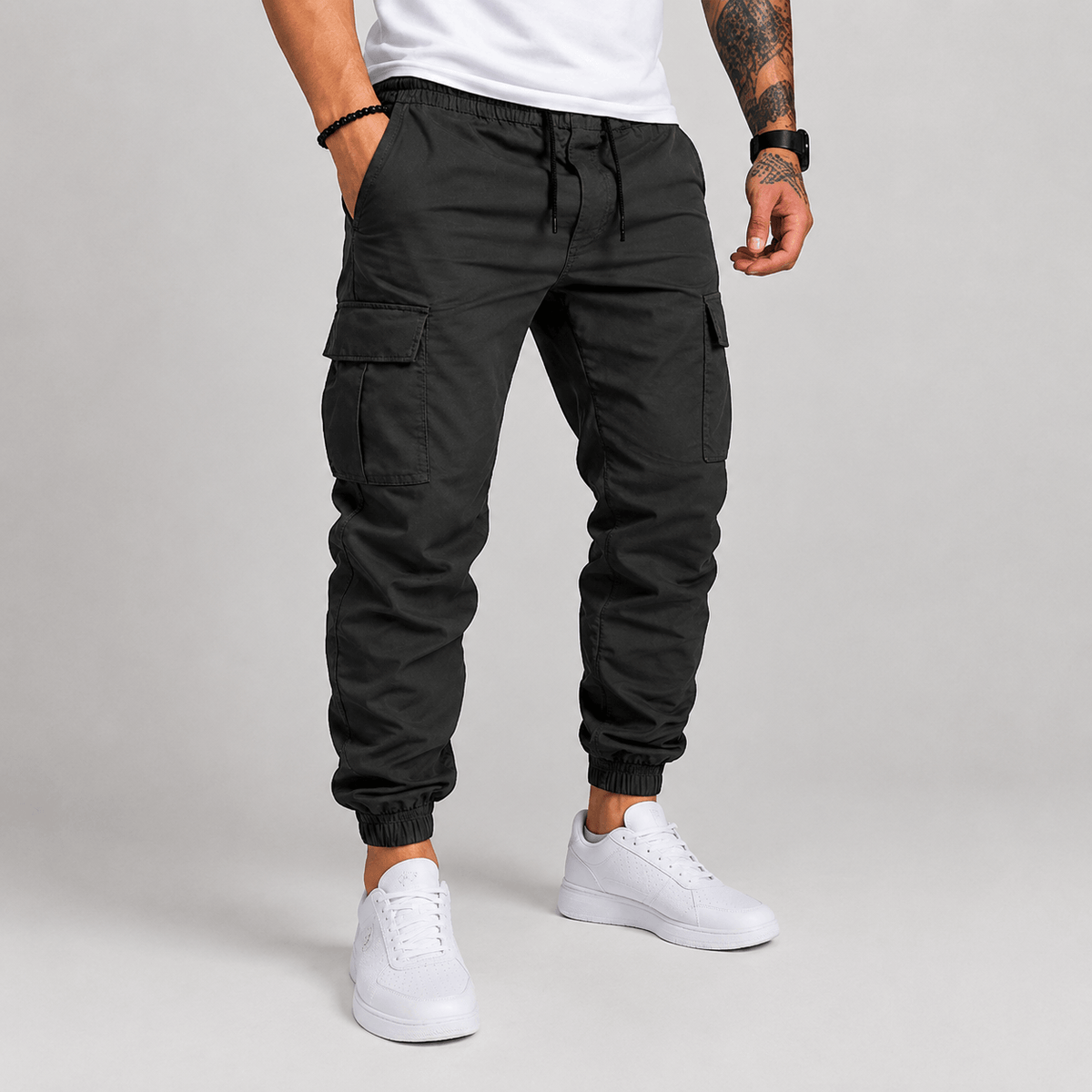 Black cargo jogger pants with drawstring waist, cargo pockets, and elastic ankle cuffs