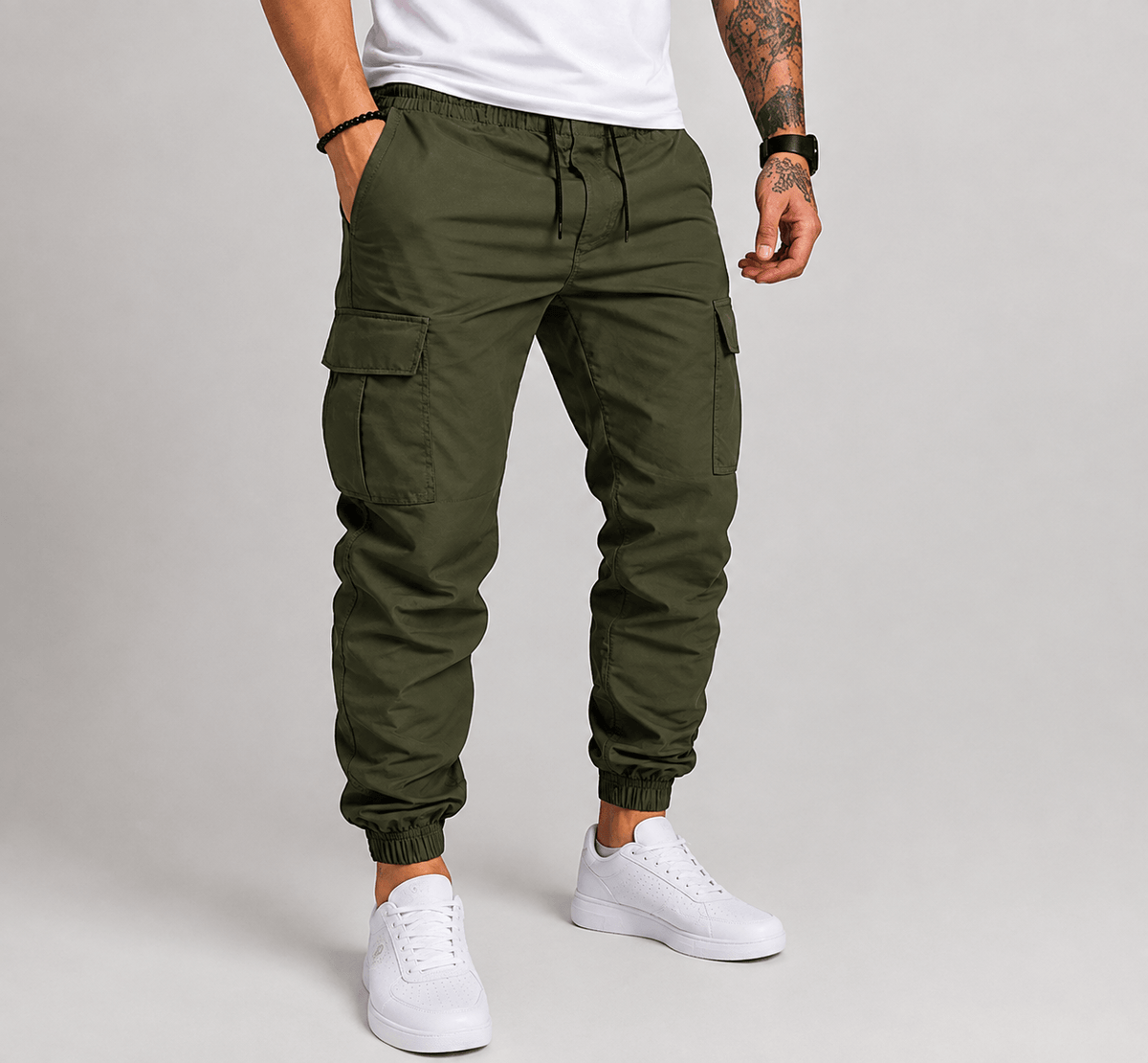 Green cargo jogger pants with drawstring waist, side pockets, and elastic ankle cuffs