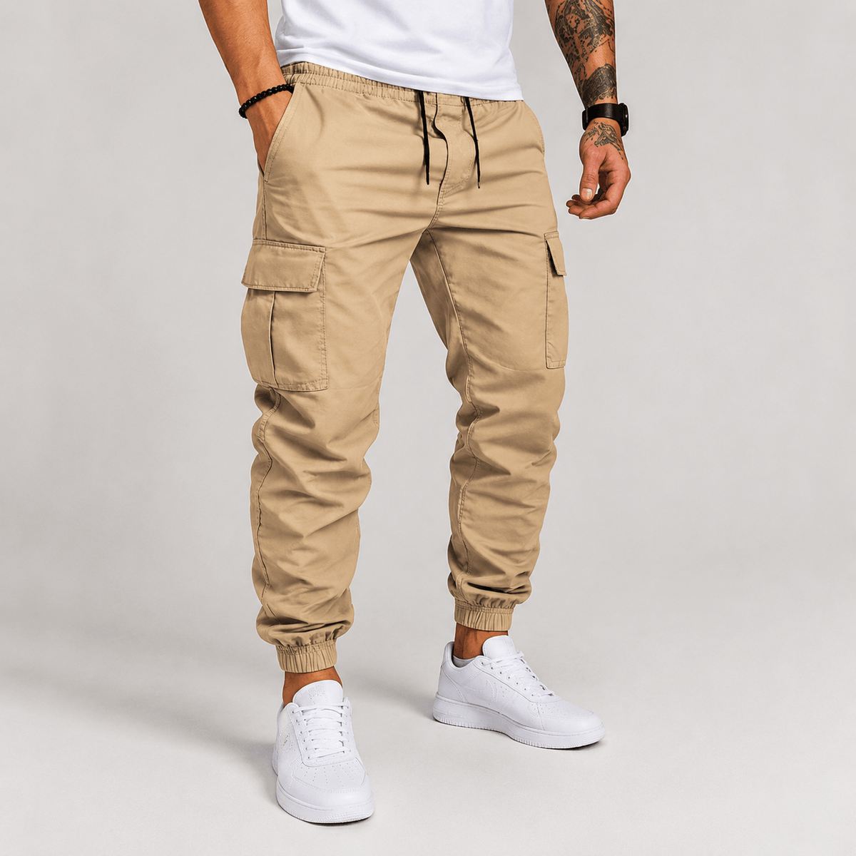 Beige cargo jogger pants with drawstring waist, cargo pockets, and elastic ankle cuffs