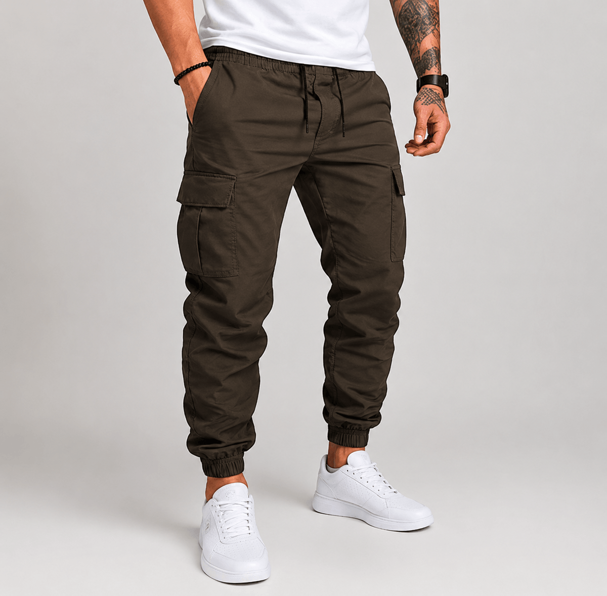 Dark brown cargo jogger pants with drawstring waist, side cargo pockets, and elastic cuffs