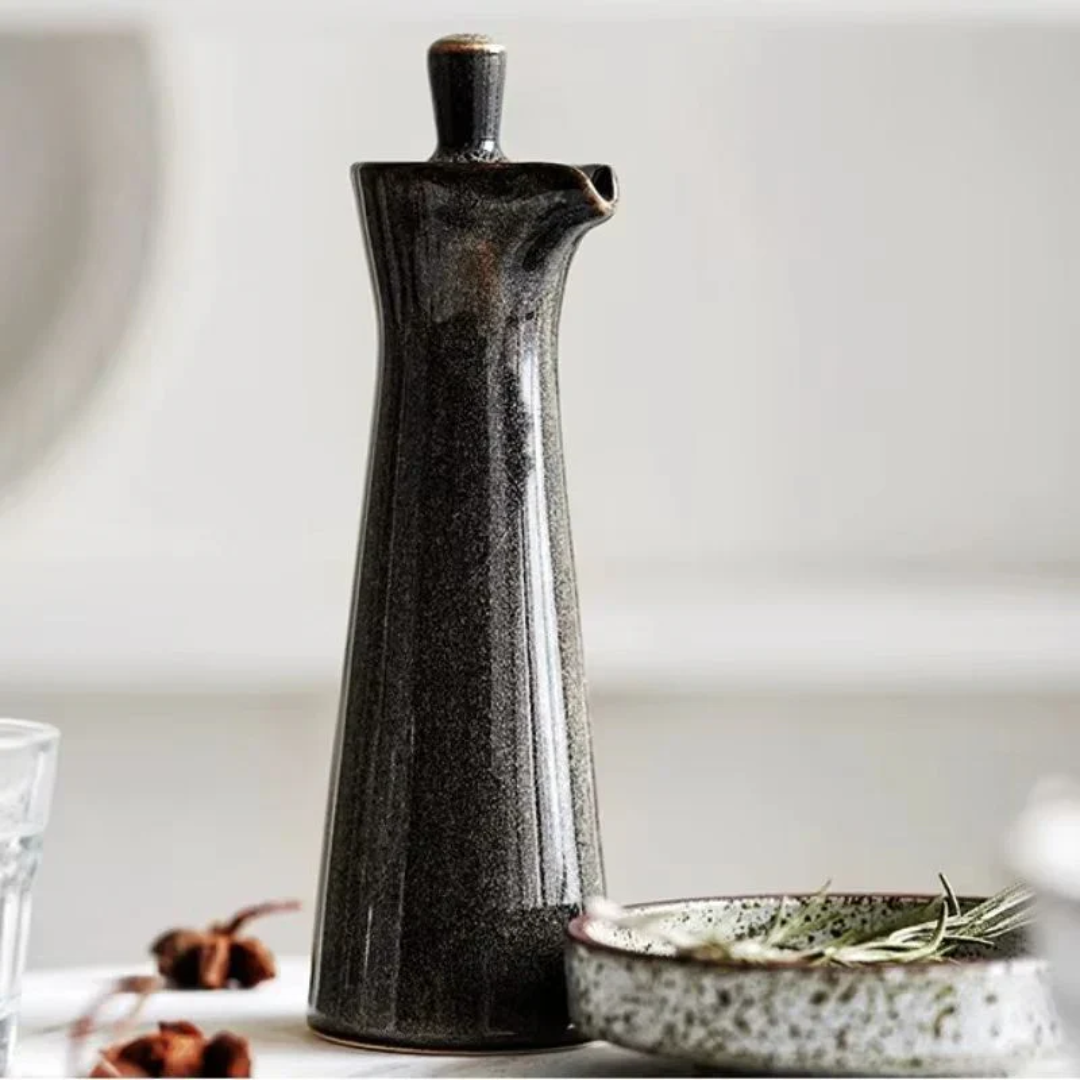 Ceramic oil dispenser, speckled dark gray finish with short capped spout