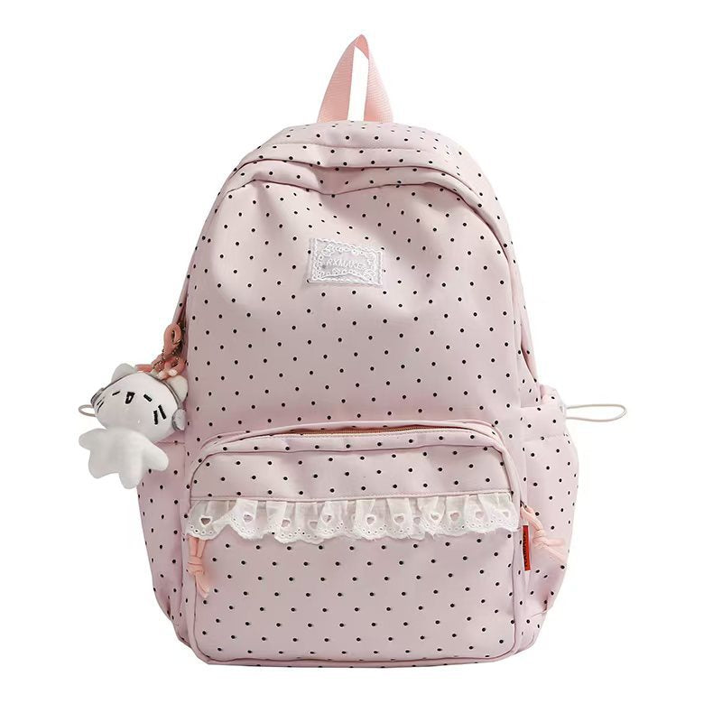 Pink polka dot ruffled backpack with front pocket and plush keychain charm