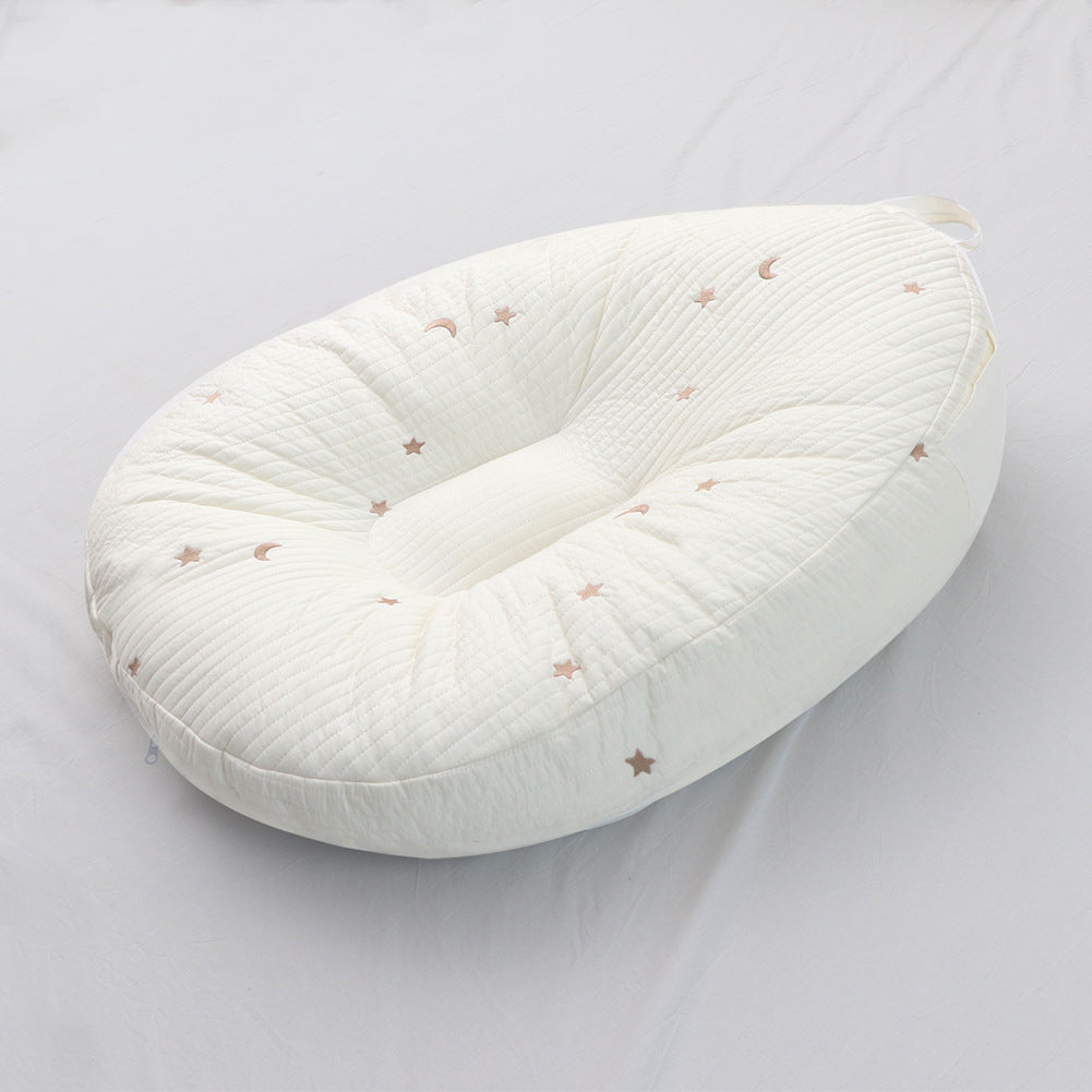 Ergonomic cotton baby lounger cover, cream quilted fabric with small star and moon motifs