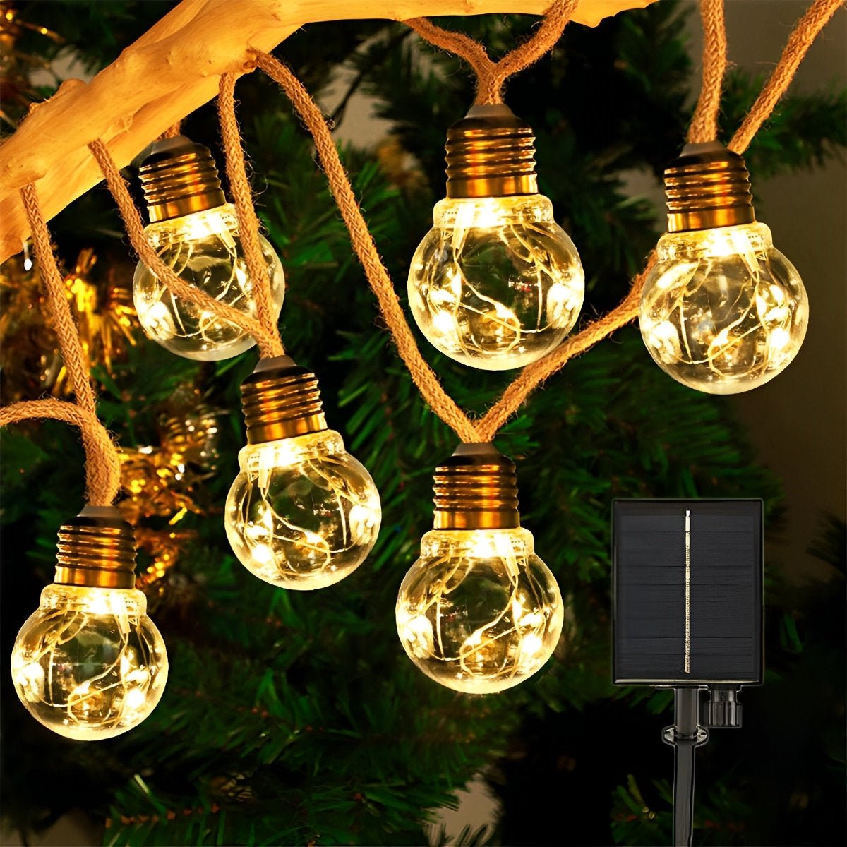 Close-up of solar string lights: glowing bulbs on brown hemp rope with gold sockets