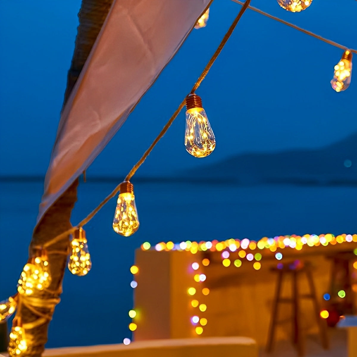 Outdoor solar string lights with amber bulbs and brown hemp rope, under a canopy