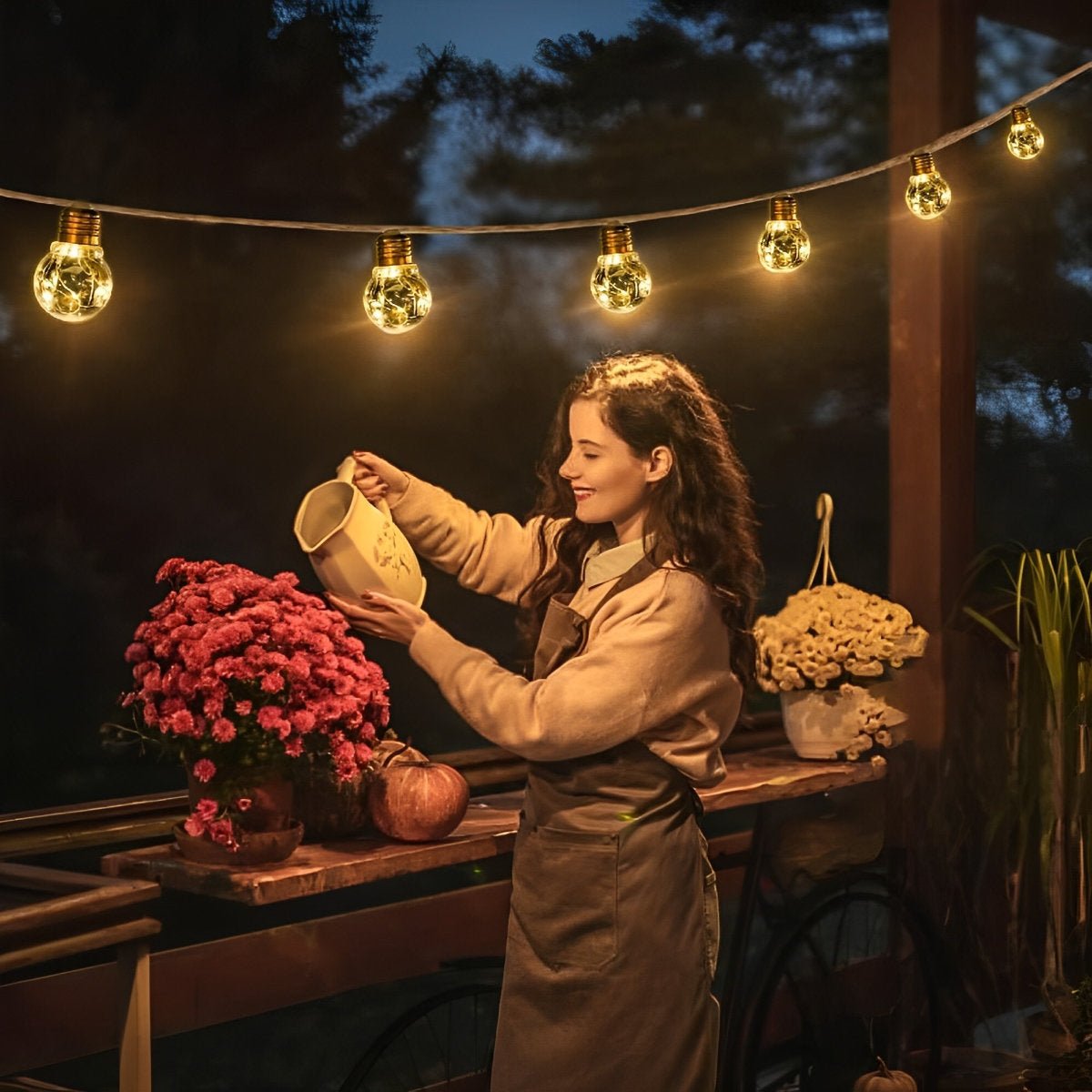 Outdoor solar string lights draped along a patio with glowing amber bulbs