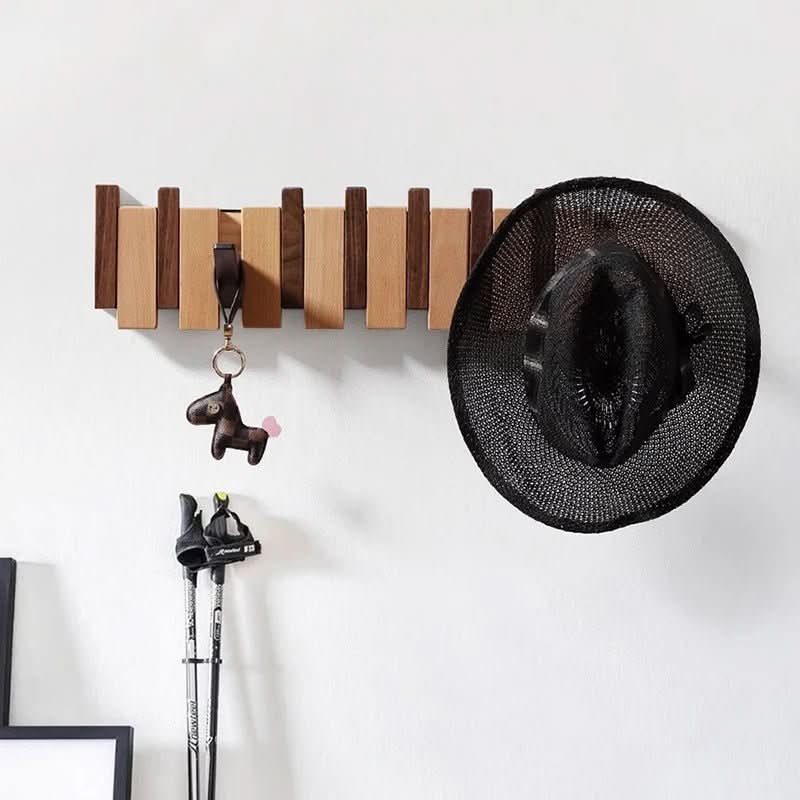 Wood wall hanger with multiple wooden hooks, hanging hat and small keychain items