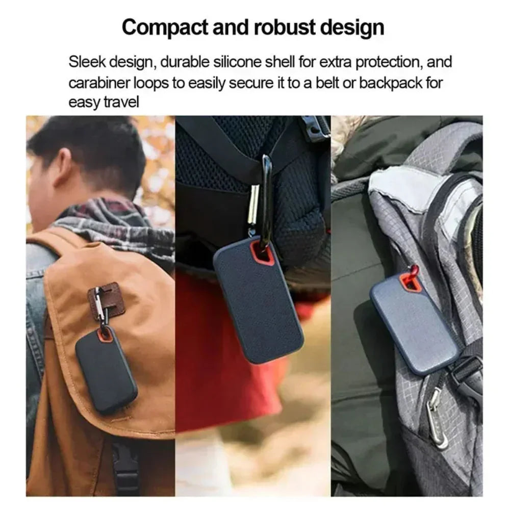 Black rugged portable drive with red accent attached to bag via carabiner clip