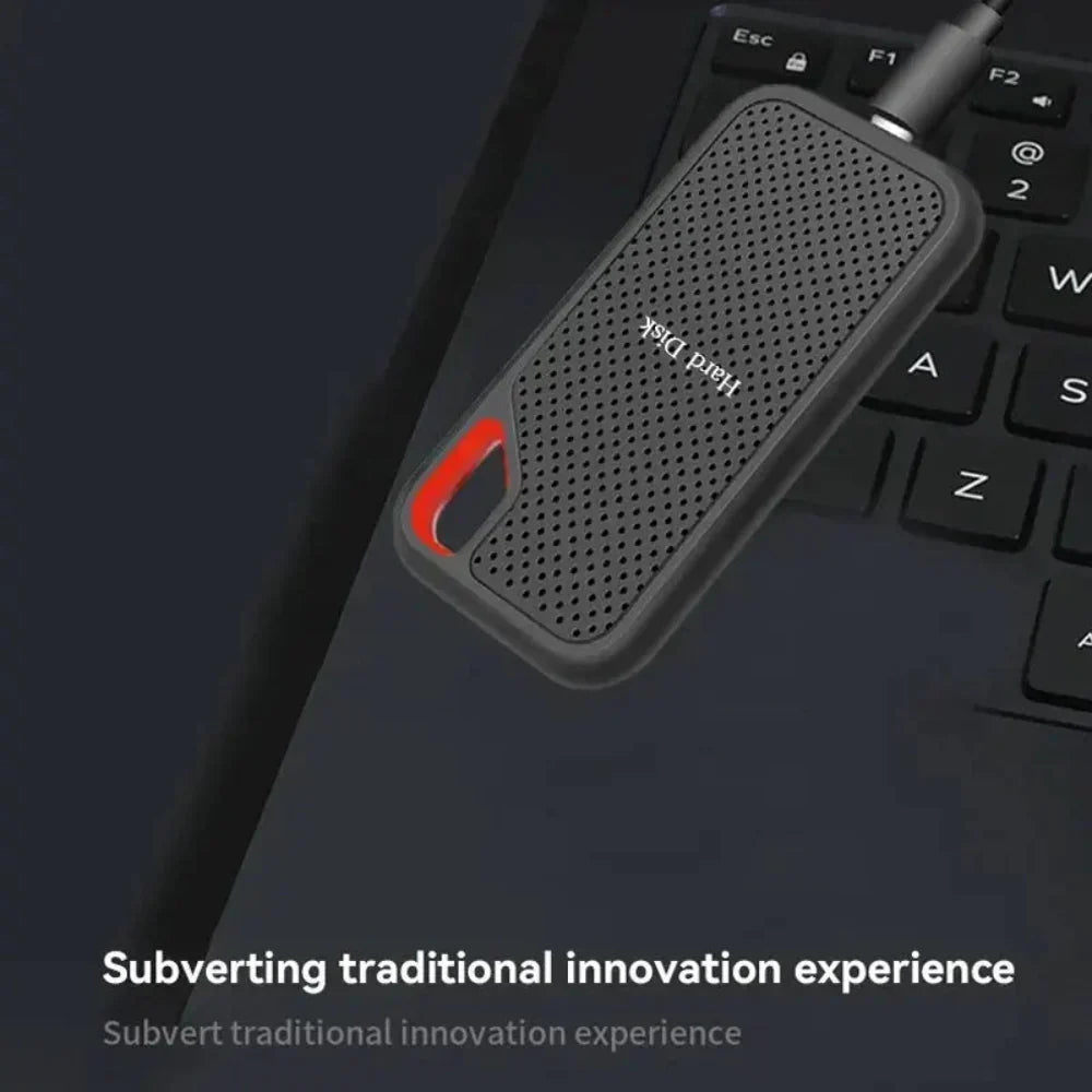 Rugged portable storage drive in black perforated housing with red carry handle