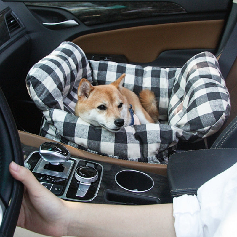 Black and white checked padded dog car booster seat with raised side bolsters
