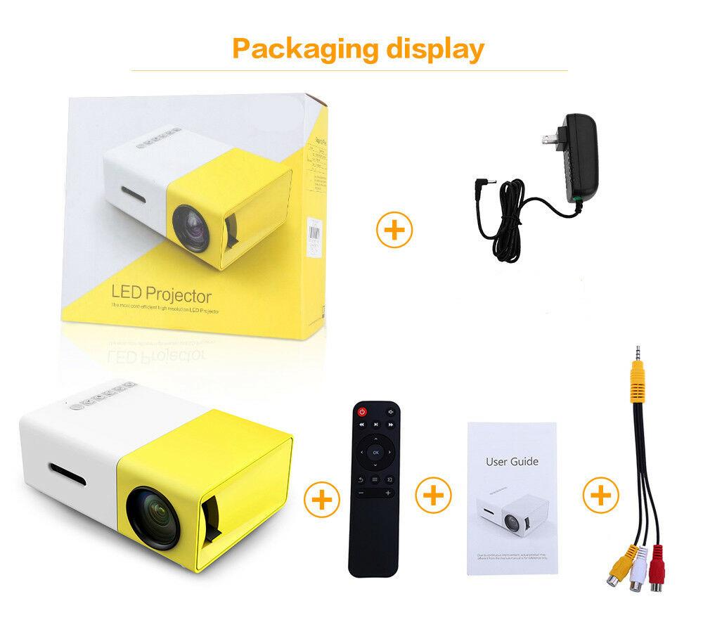 Mini projector kit with white and yellow projector box, remote, cables, and user guide