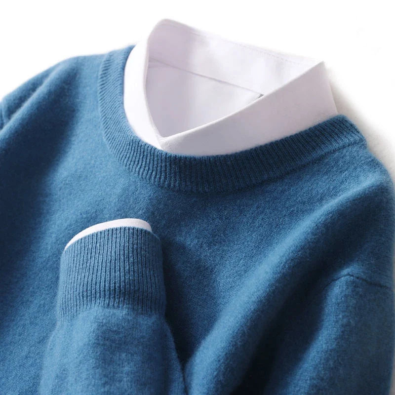 Men's ribbed crew neck sweater in blue, with ribbed collar and cuffed sleeves.