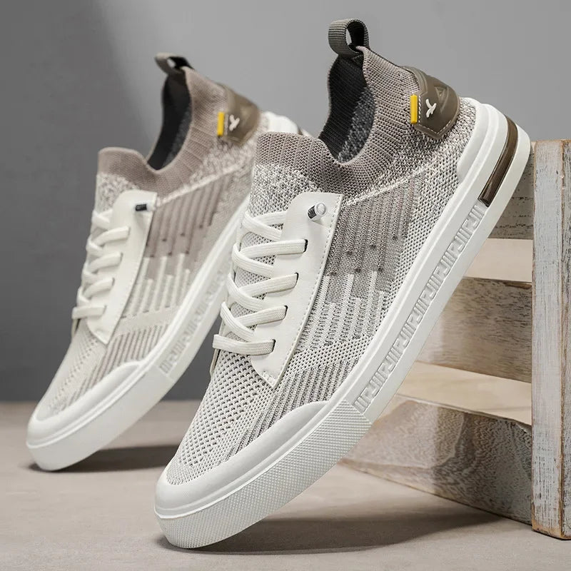 Men's knit sneakers in off-white/gray with navy heel panel, lace-up, patterned knit