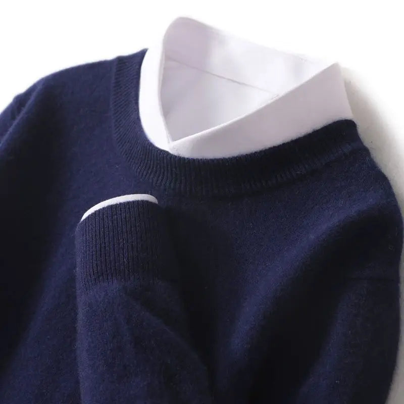Men's ribbed crew neck sweater in navy, showing ribbed collar and cuffs.