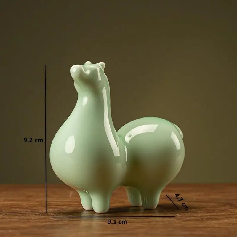 Light green glazed ceramic horse figurine, rounded body and upright neck