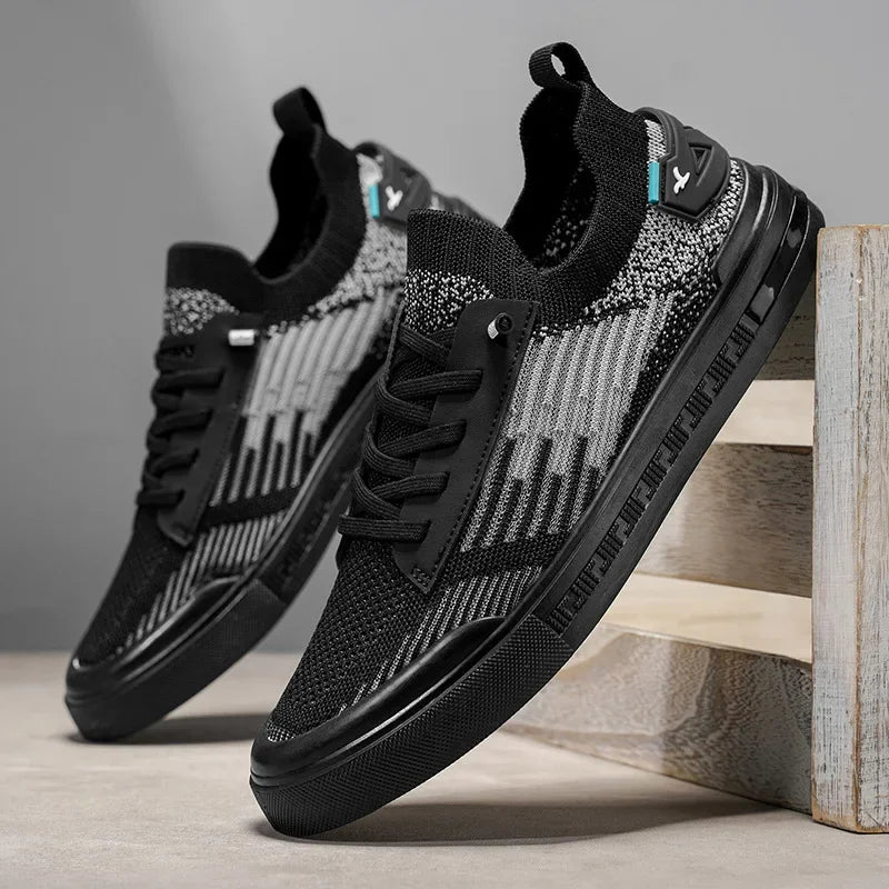Men's knit sneakers in black with gray speckled stripes, lace-up, cushioned sole
