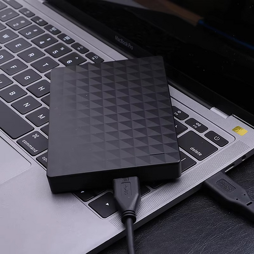 8TB USB 3.0 external hard drive, textured black top and USB cable attached