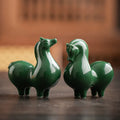 Ceramic horse figurines, dark green glossy glaze, two horses side by side.