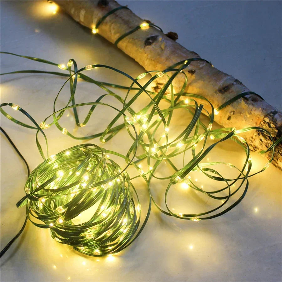 Outdoor LED rope string lights with warm white bulbs along a curved rope