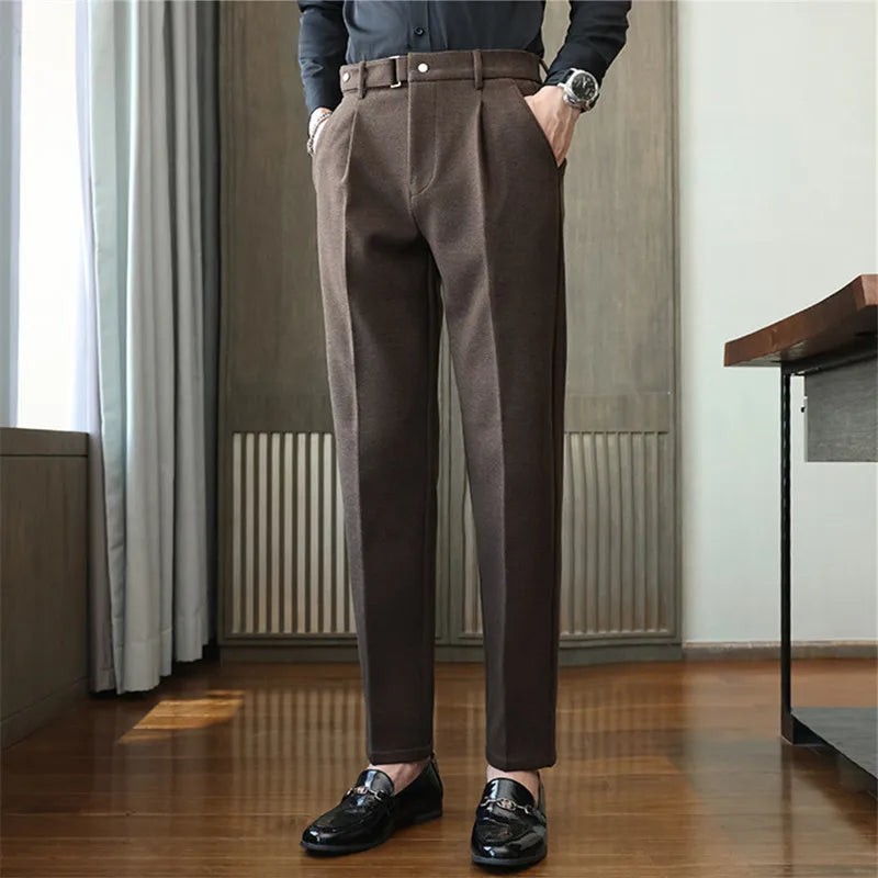 Sleek herringbone tailored trousers, texture close-up