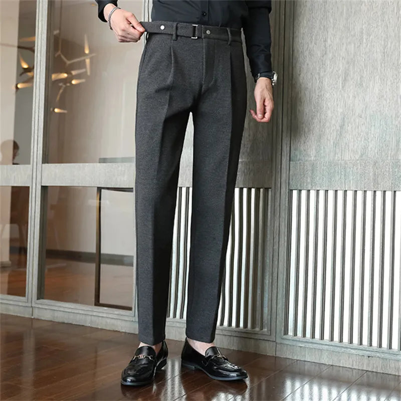 Sleek herringbone tailored trousers, close-up detail