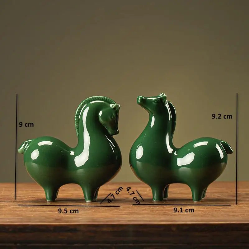 Ceramic horse figurines, dark green glossy glaze, two horses with size markers.