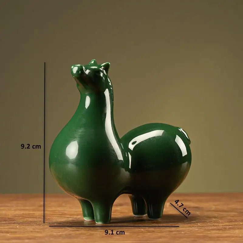 Dark green glazed ceramic horse figurine, arched neck and curled tail