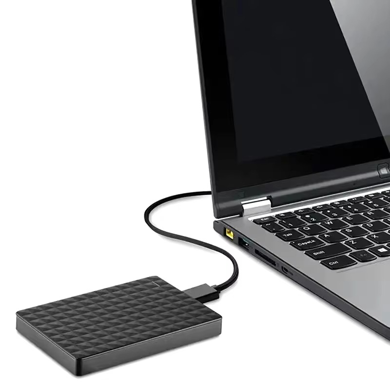 Black USB external hard drive with textured panel and connected USB cable