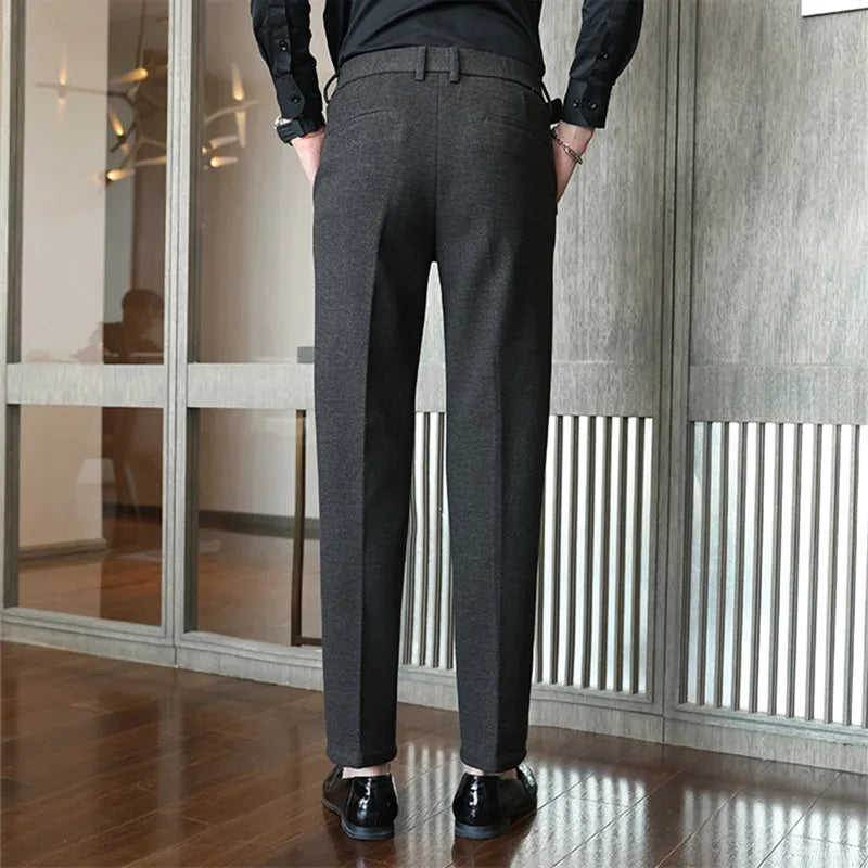 Sleek herringbone tailored trousers, styled front view