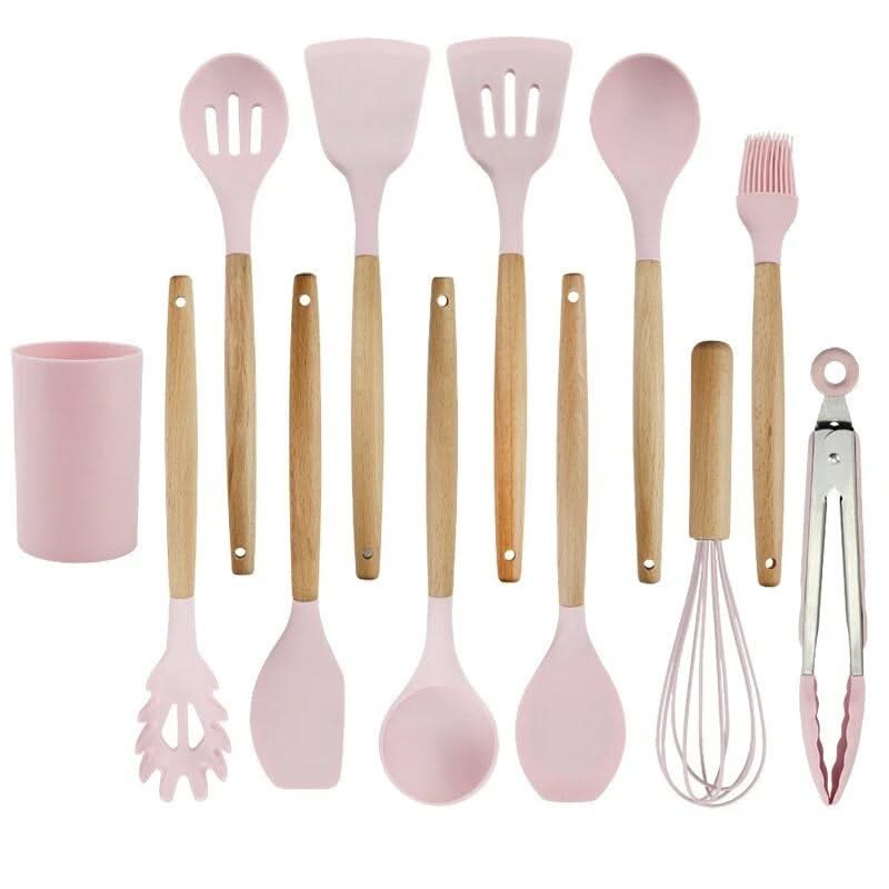 Pink silicone utensil set with wooden handles and wire whisk