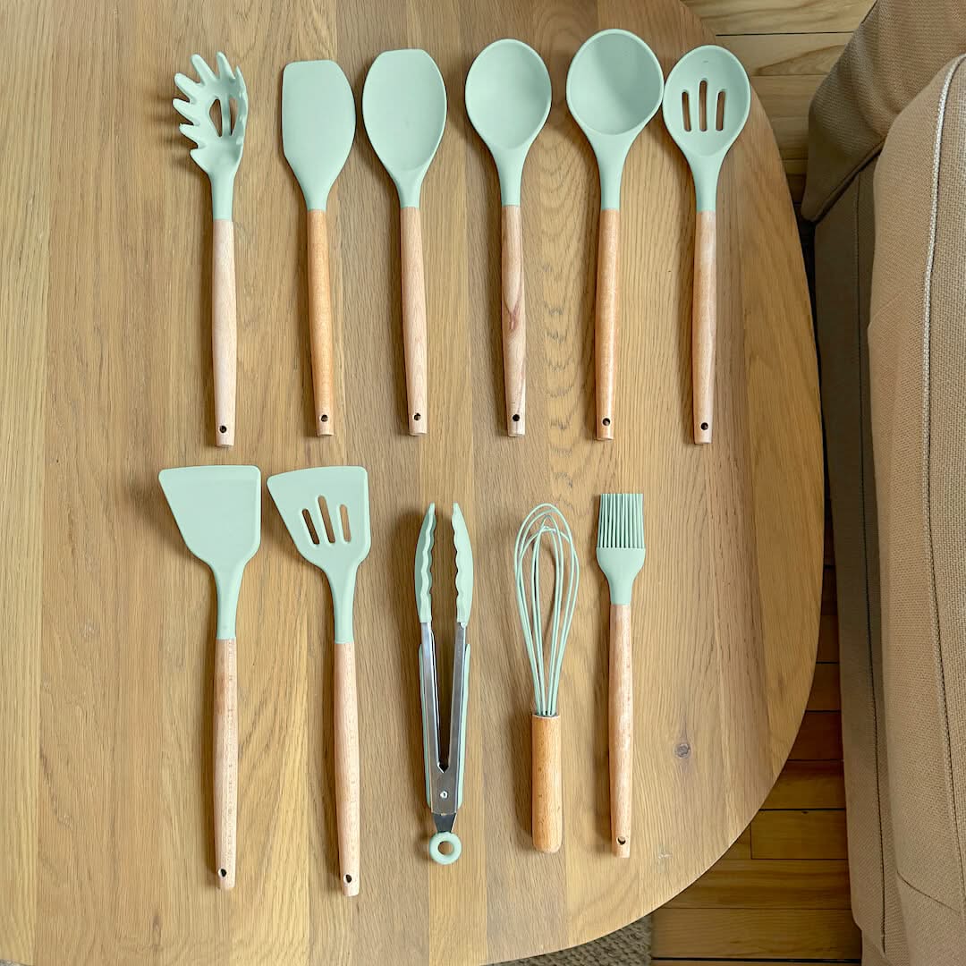 Mint green silicone cooking utensil set with wooden handles and ladles