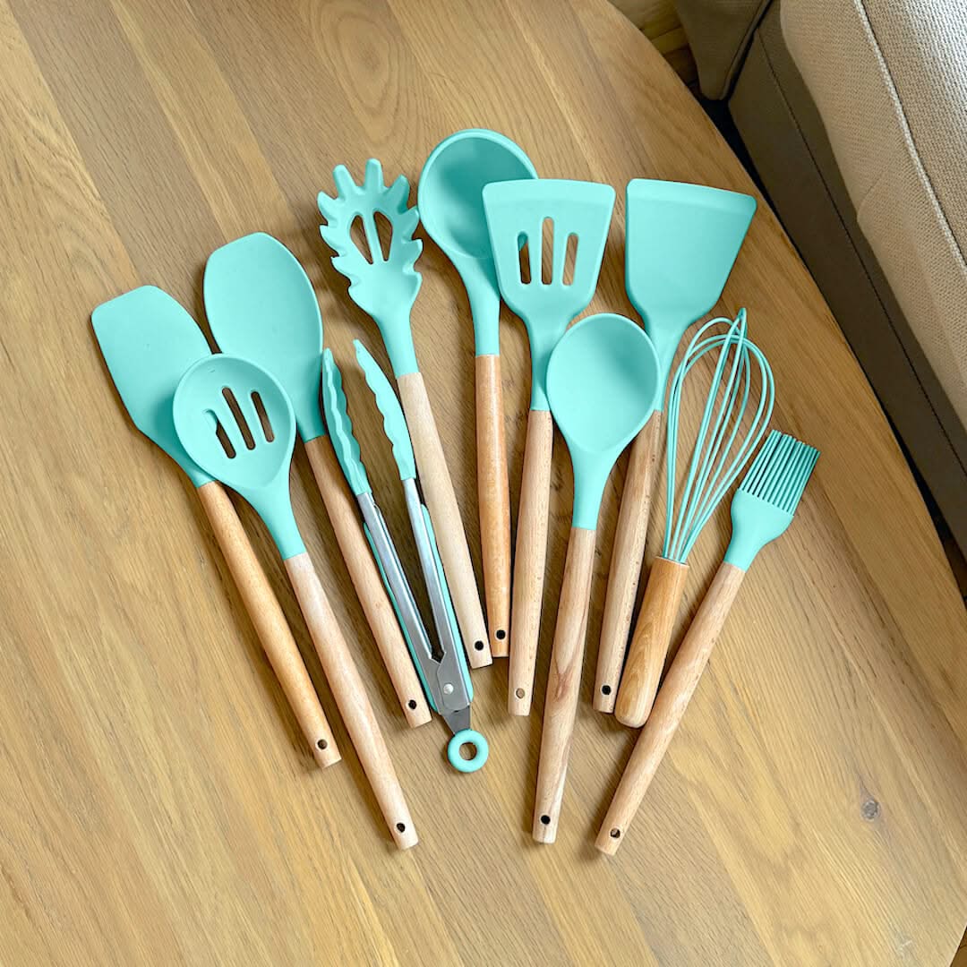 Aqua silicone cooking utensil set with wooden handles and wire whisk