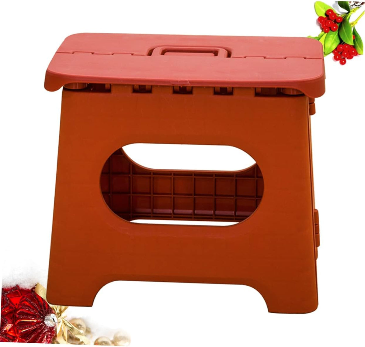 Foldable step stool in orange with oval safety cutout and foldable top handle.