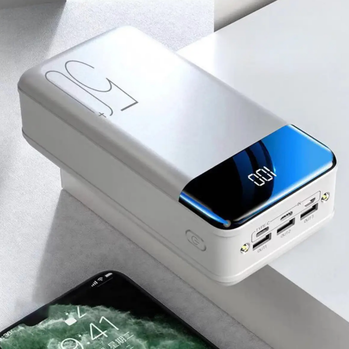 White 50,000mAh fast-charging power bank with blue charging indicator and USB ports