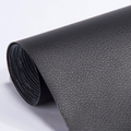 Self-adhesive leather patch repair roll in black with textured leather grain