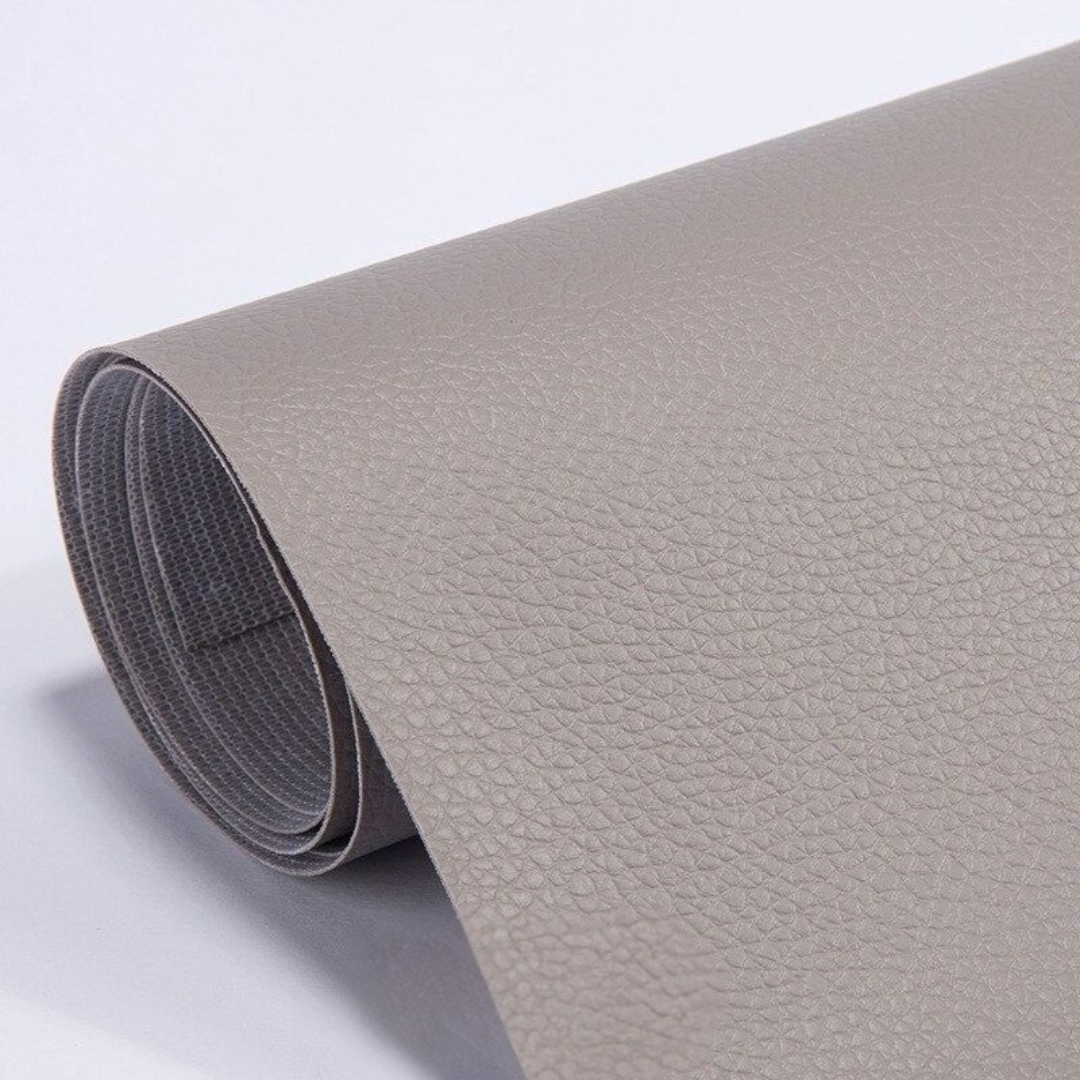 Self-adhesive leather patch repair roll in light gray with fine textured leather grain