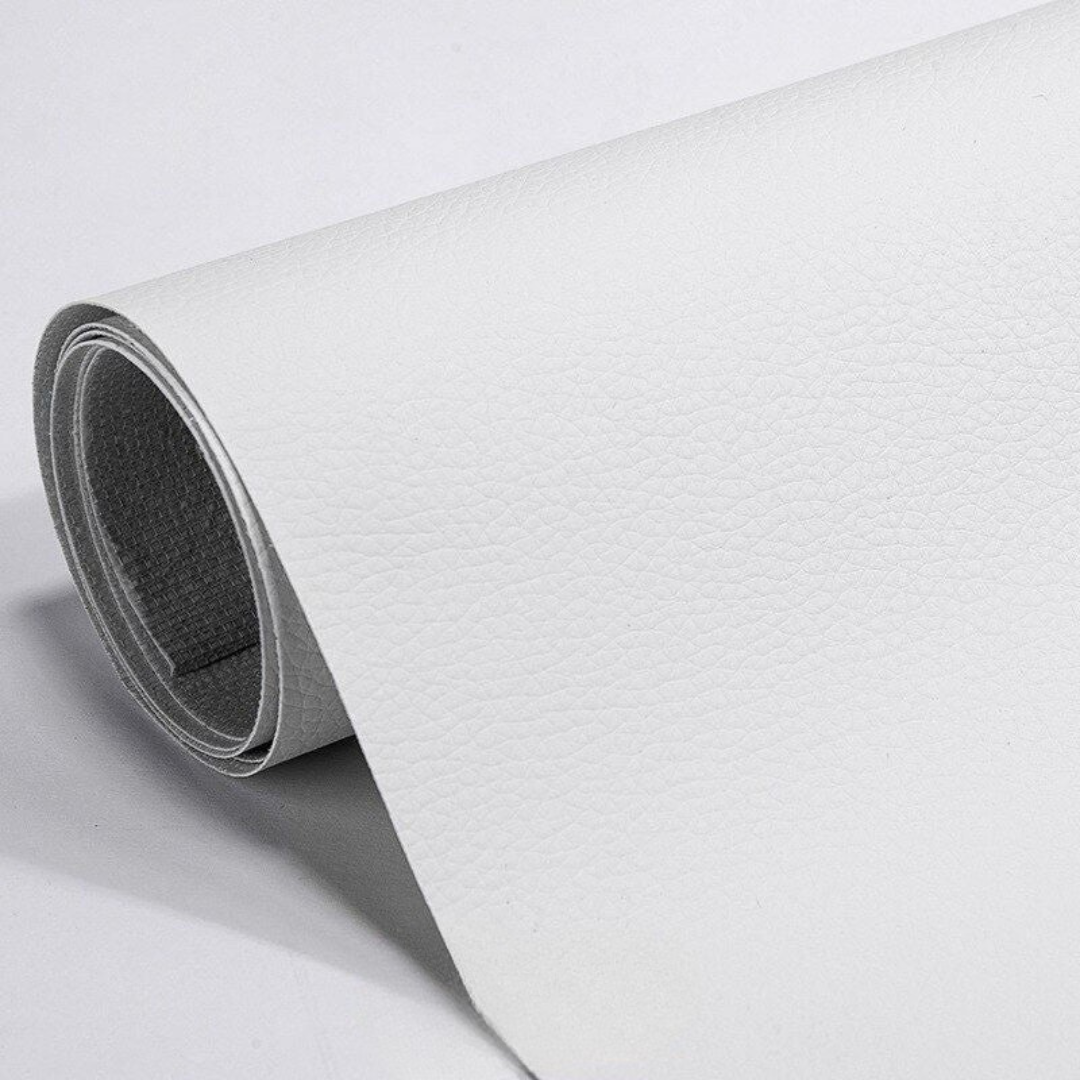 Self-adhesive leather patch repair roll in white, textured grain, dark backing visible