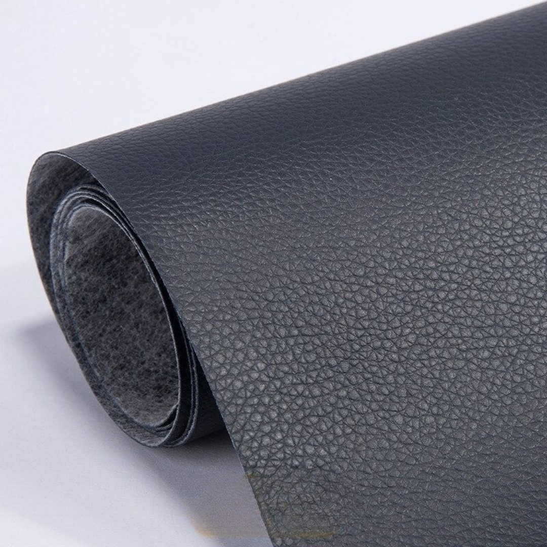 Self-adhesive leather patch repair roll in dark navy blue with textured leather grain