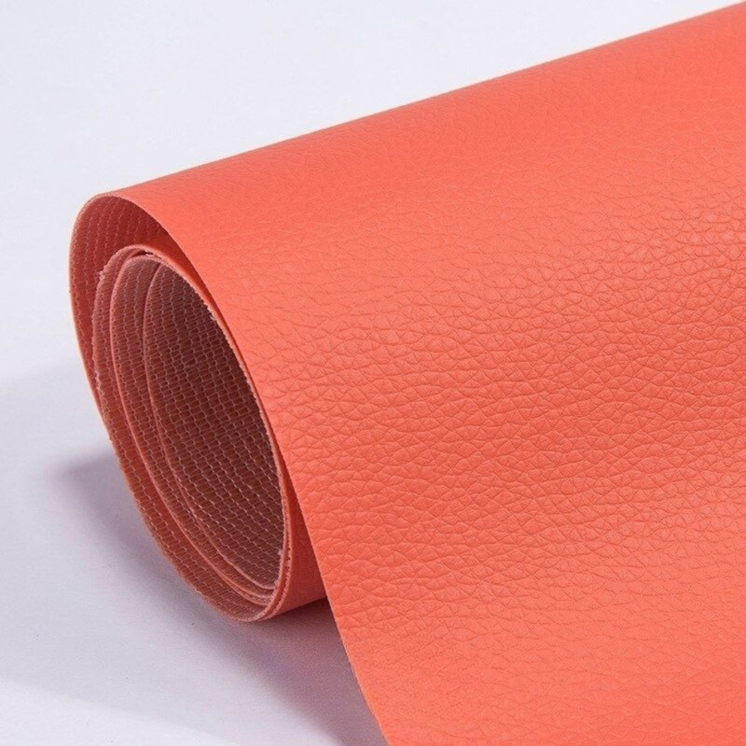 Self-adhesive leather patch repair roll in bright orange with textured leather grain