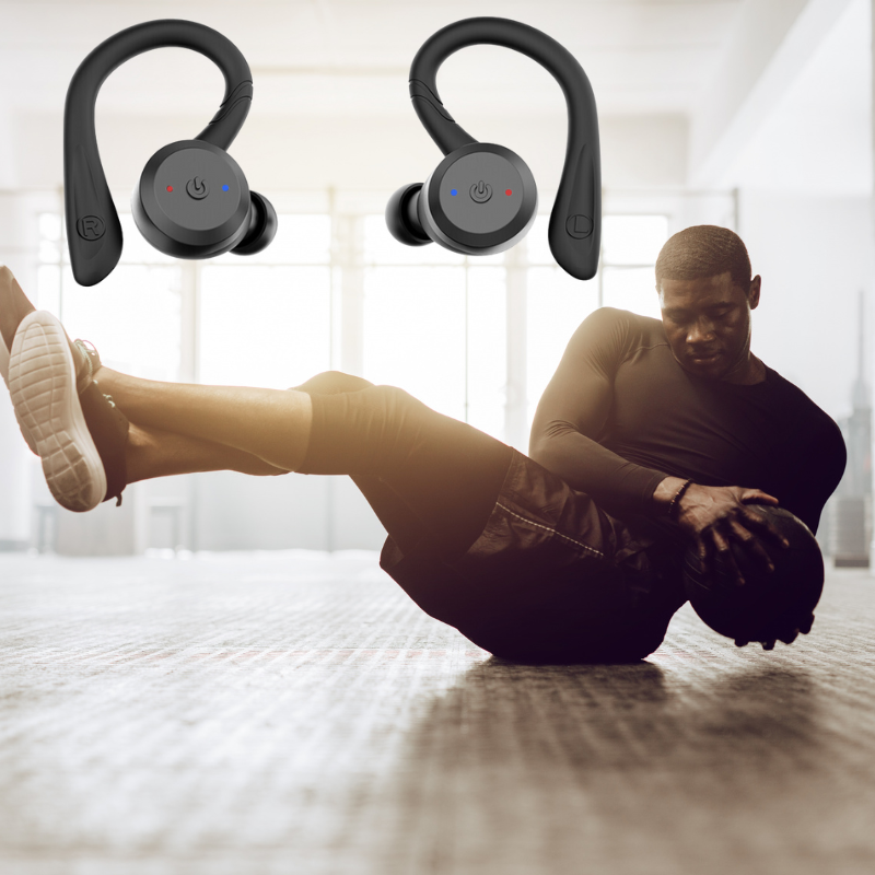 Black wireless sport earbuds with ear hooks being worn, control lights visible