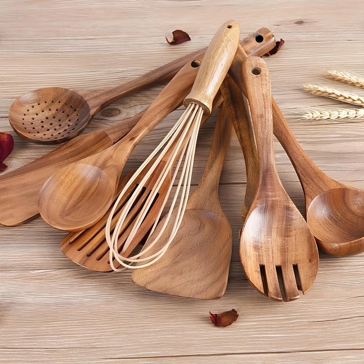 Assorted wooden kitchen utensils, including ladles, spoons, and a whisk, on a board